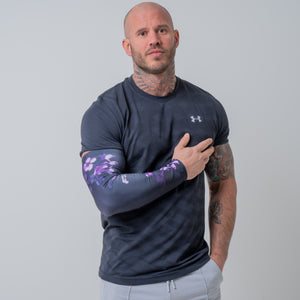 Male Athlete wearing FlexoGear's Hanami Compression Arm Sleeve during a photoshoot.