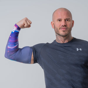 Athlete achieving peak performance in sports with FlexoGear's Compression Arm Sleeve.